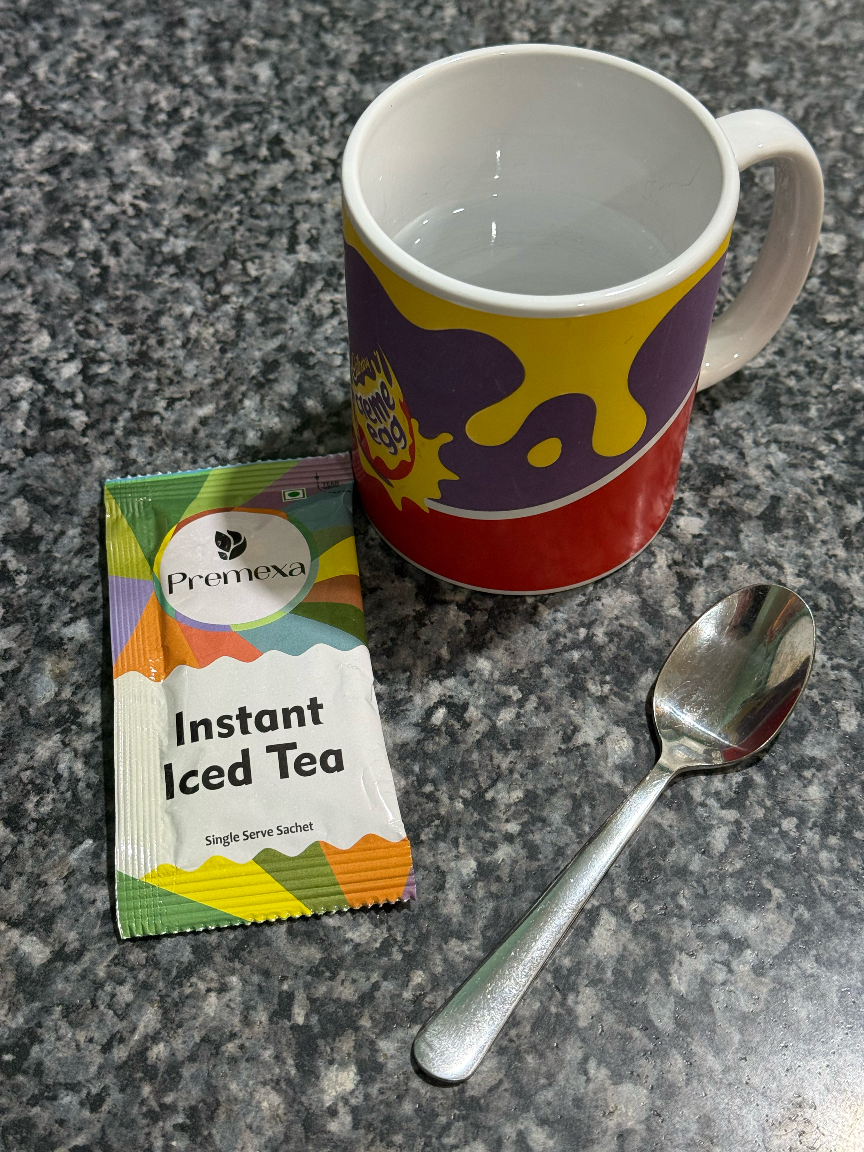 The ingredients: sachet, small mug, teaspoon. You'll have to imagine the ice cube, it's still in the freezer at this point.