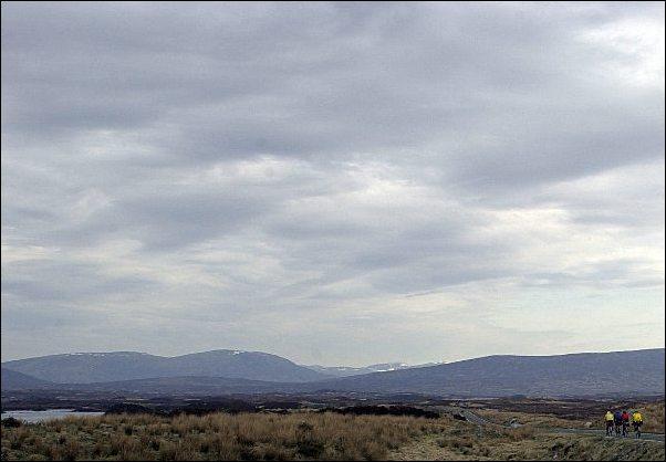 The A82 road north to the Scottish Highlands. The cyclists at the bottom right may or may not be having fun. It's overcast and bleak but remains an impressive landscape.